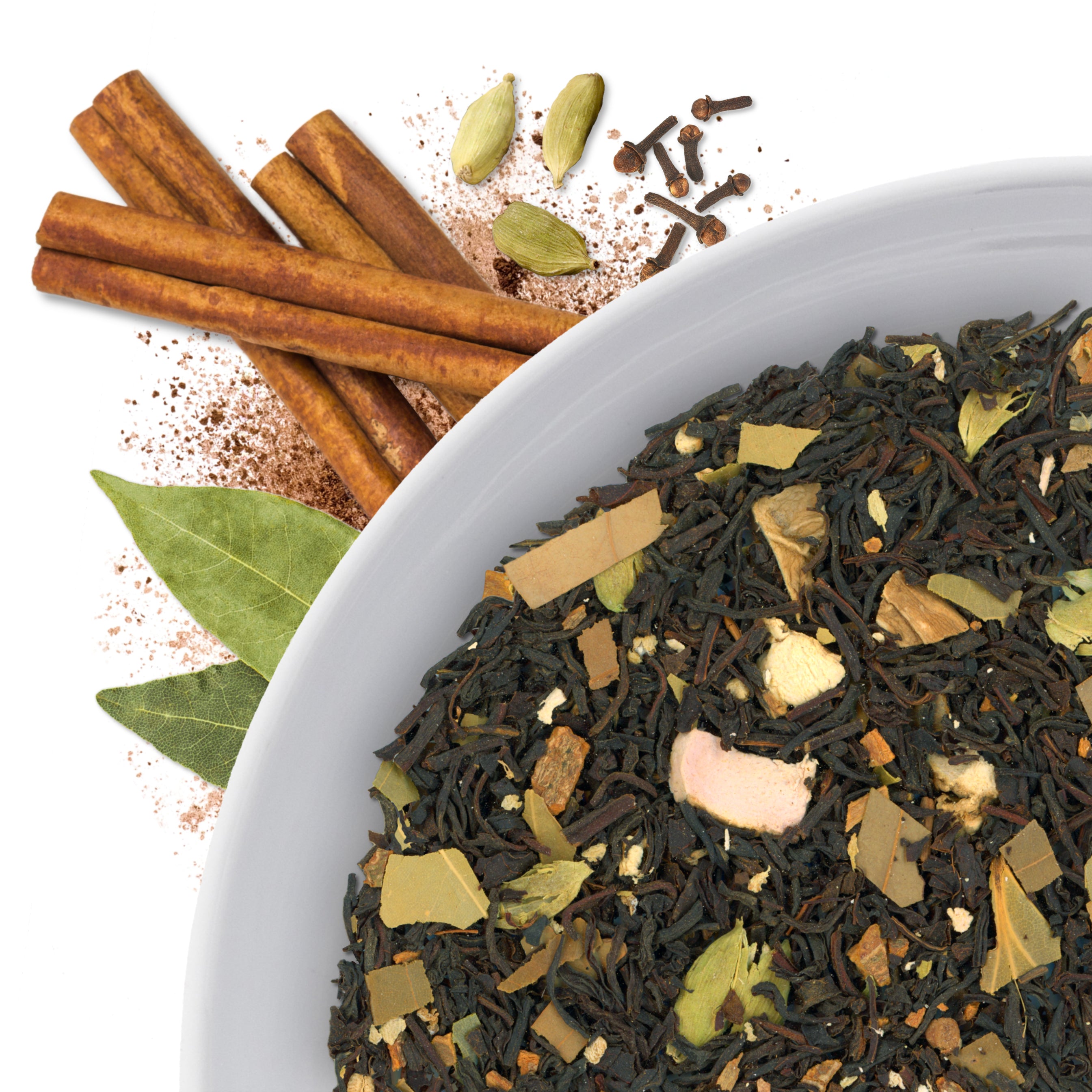 The corner of a bowl of Masala Chai loose leaf black tea, with flavor notes displayed as cinnamon, cardamom, cloves, and bay leaves.