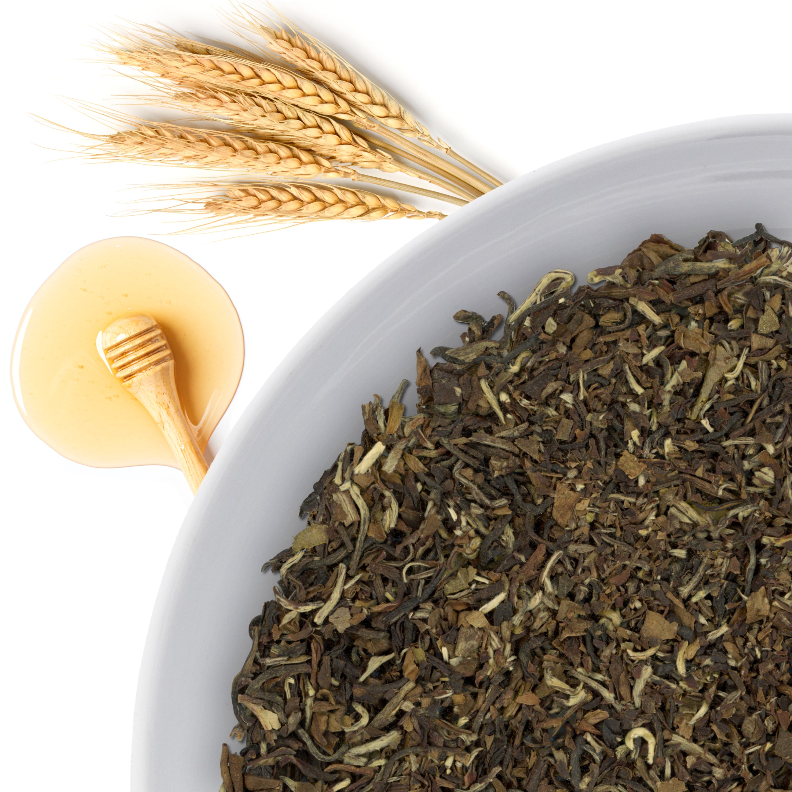 The corner of a bowl of Opal Spring loose leaf white tea, with flavor notes displayed as honey with malty notes.